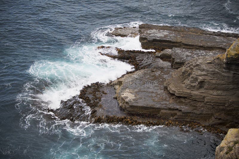 Waves crashing on Rocks