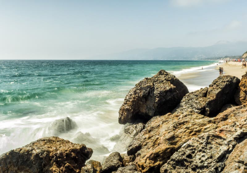 ZUMA BEACH, CALIFORNIA, USA - People on Zuma beach, public beach