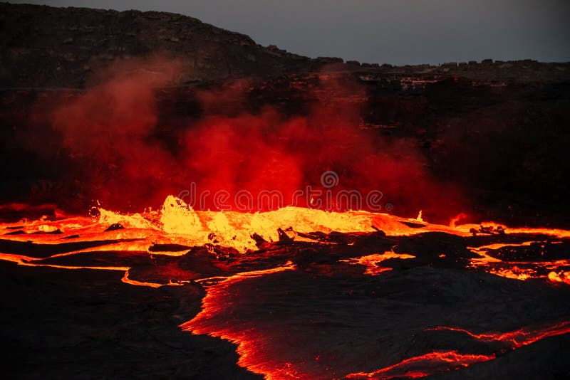 Waves of lava at the surface of Erta Ale lava lake stock photography
