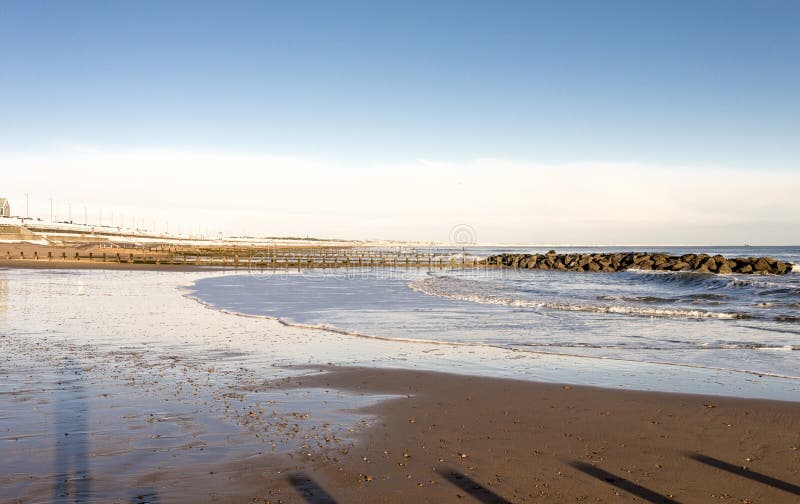 Waves of the North Sea enter the city beach in a nice sunny winter day, Aberdeen, Scotland royalty free stock images Waves of the North Sea enter the city beach in a nice sunny winter day, Aberdeen, Scotland royalty free stock images