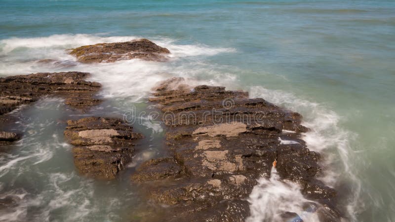 Waves over rocks