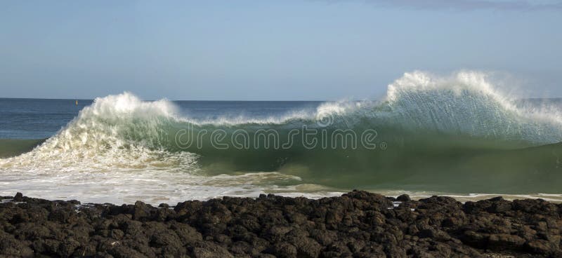 Waves pounding on basalt rocks at Ocean Beach Bunbury Western Australia stock photography Waves pounding on basalt rocks at Ocean Beach Bunbury Western Australia stock photography