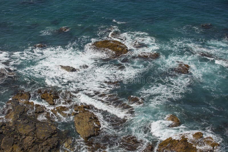 Waves an Rocks stock photo. Image of coast, blue, nature - 155575408