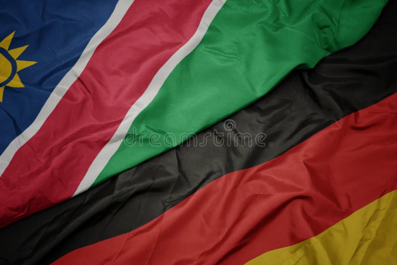 Waving Colorful Flag of Germany and National Flag of Namibia Stock