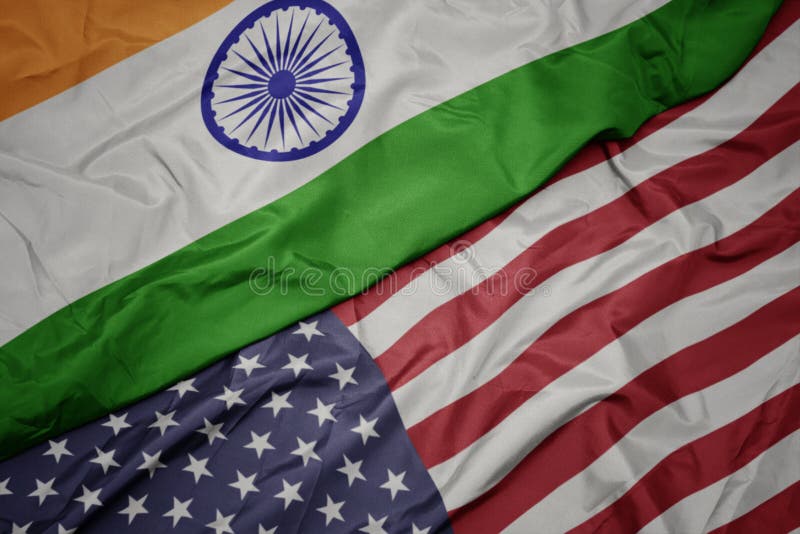 waving colorful flag of united states of america and national flag of india.macro