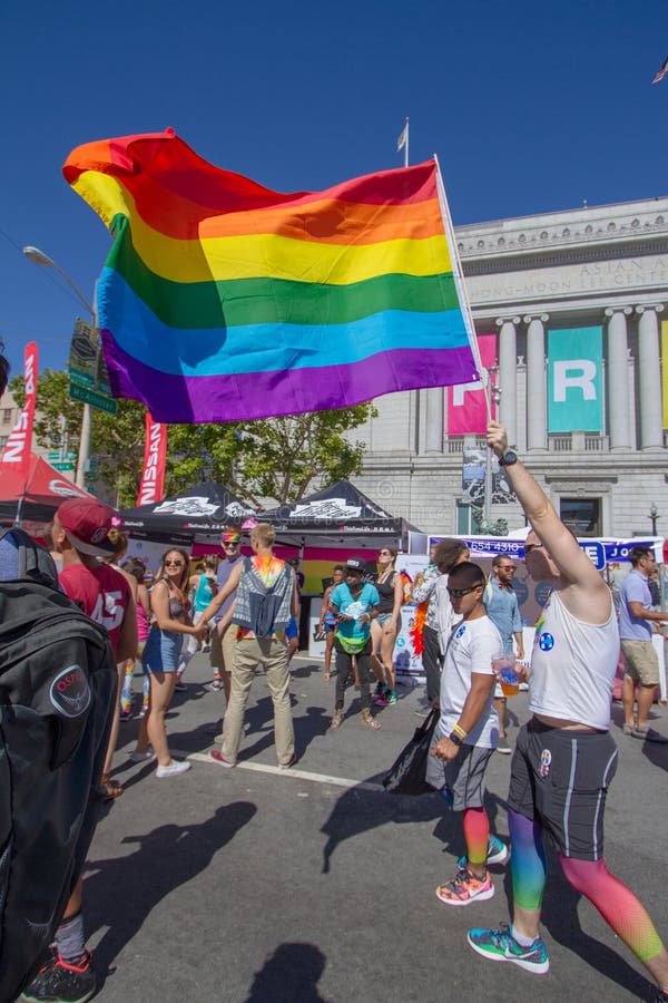 Waving the Rainbow Pride Flag in San Francisco Editorial Stock Image