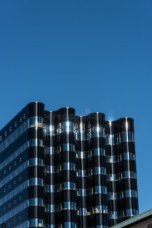 Wavy Formed Glass Facade of a Newly Constructed Office Skyrise.. Stock