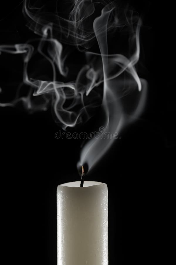 Wax Candle with Burning Wick and Smoke, Isolated on a Black Background