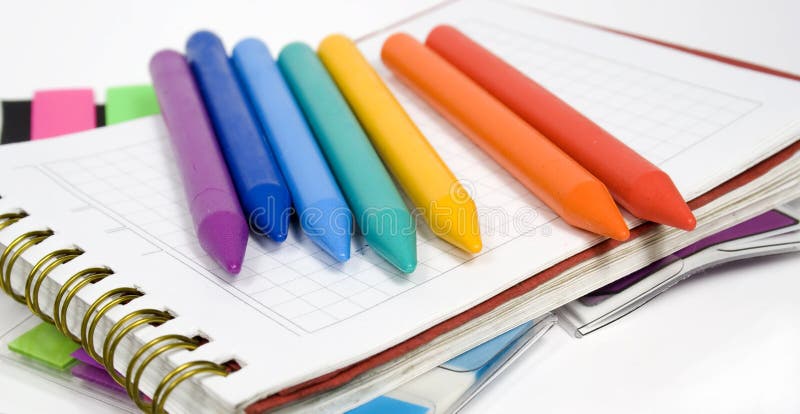 Wax pencils on notebook