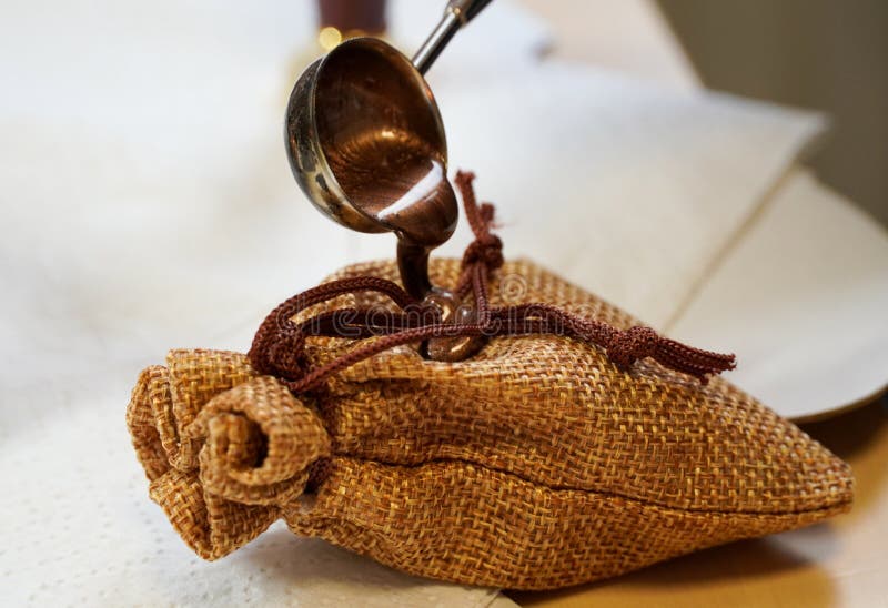 Wax Seal Making On Craft A Bag Of Linen Man Fingers Handmade Stock wax-seal-making-on-craft-a-bag-of-linen-man-fingers-handmade-stock