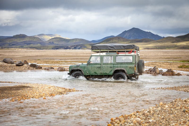 4WD car wades river in Landmannalaugar, Iceland. 4WD car wades river in Landmannalaugar, Iceland