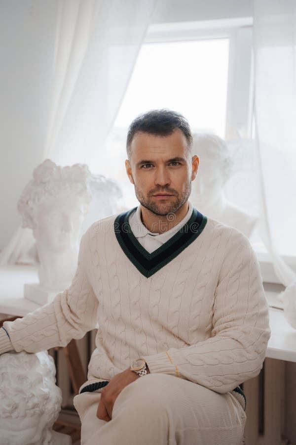 Wealthy Gentleman in Oldmoney Style in a Softly Lit Room Stock Photo