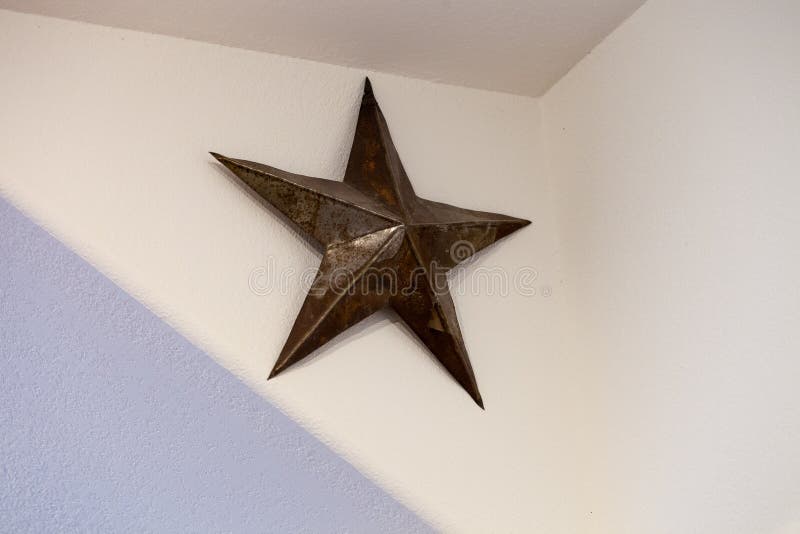 Weathered Texas star hanged on the wall