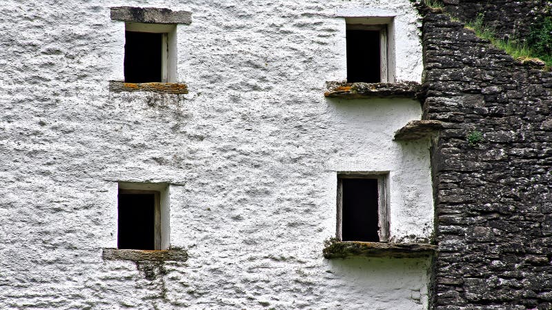 Ancient Whitewashed Stone Wall with Windows Good Resolution Stock Photo royalty free illustration