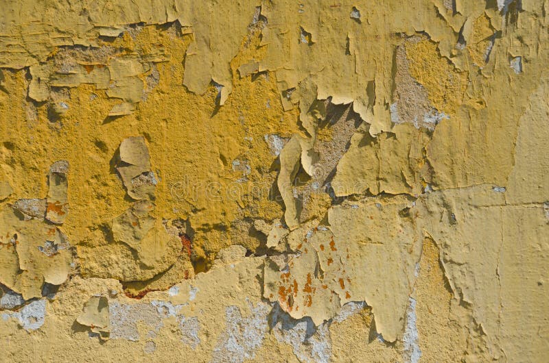 Abstract Background of Cracked and Peeling Yellow Paint Stock Image