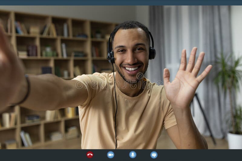 Web conference. Happy arab freelancer man in headset making video call and gesturing hello, monitor screenshot, collage stock photos