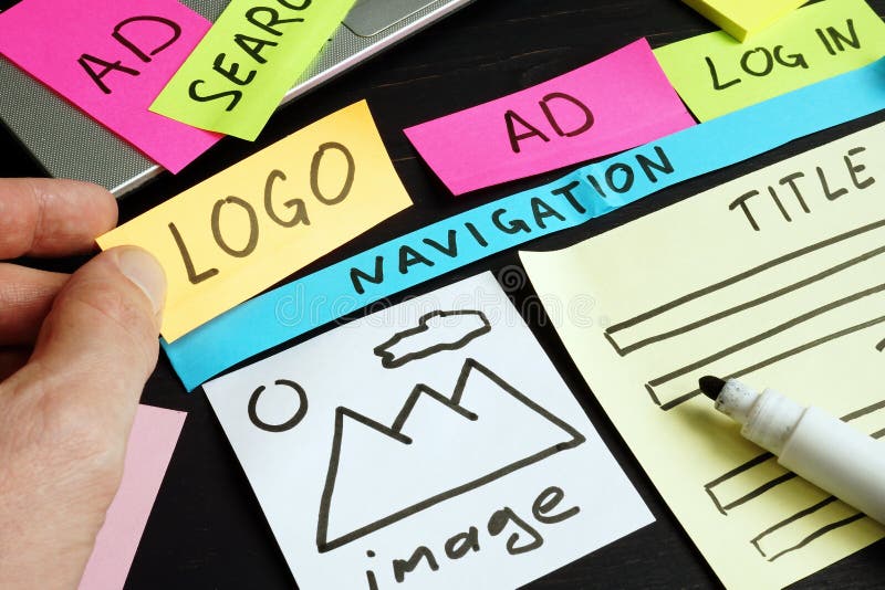 Web designer creating and planning site with sketch stock images