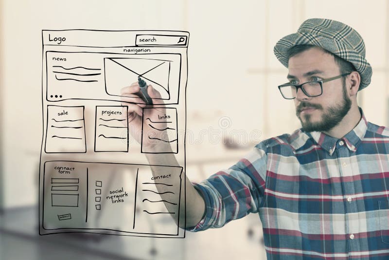 Web designer drawing website development wireframe at office stock images