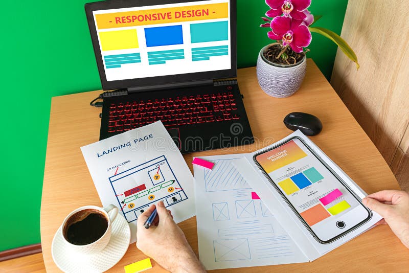 Web designer hand sketching responsive website for laptop and mobile phone stock images Web designer hand sketching responsive website for laptop and mobile phone stock images