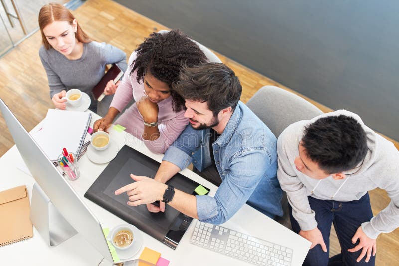 Web designer team on the computer in the office royalty free stock photography