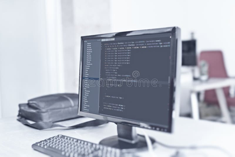 Web site codes on computer monitor at office stock images