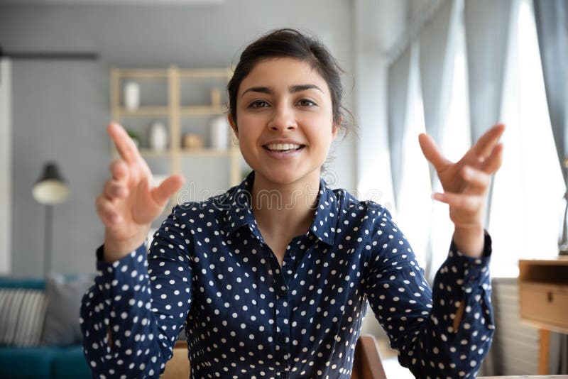 Webcam view Indian woman sit indoor talking using videoconference application stock image