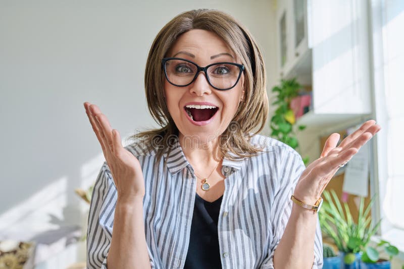 Webcam View Of Positive Mature Woman Making Video Call At Home Stock