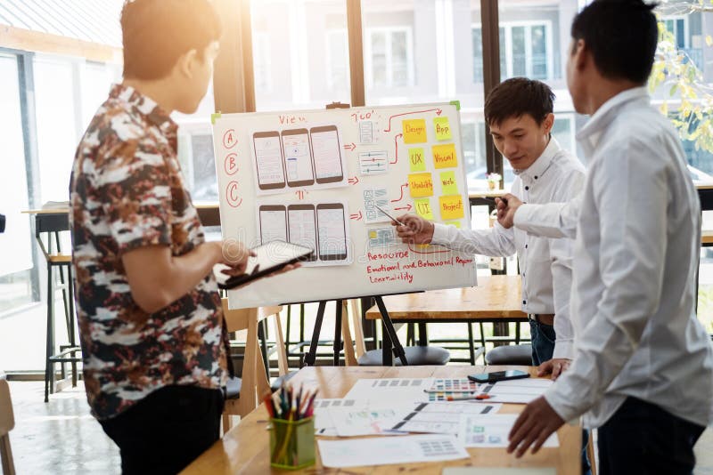 Website designer creative Graphic meeting for planning of application mobile phone. User experience concept stock photo Website designer creative Graphic meeting for planning of application mobile phone. User experience concept stock photo
