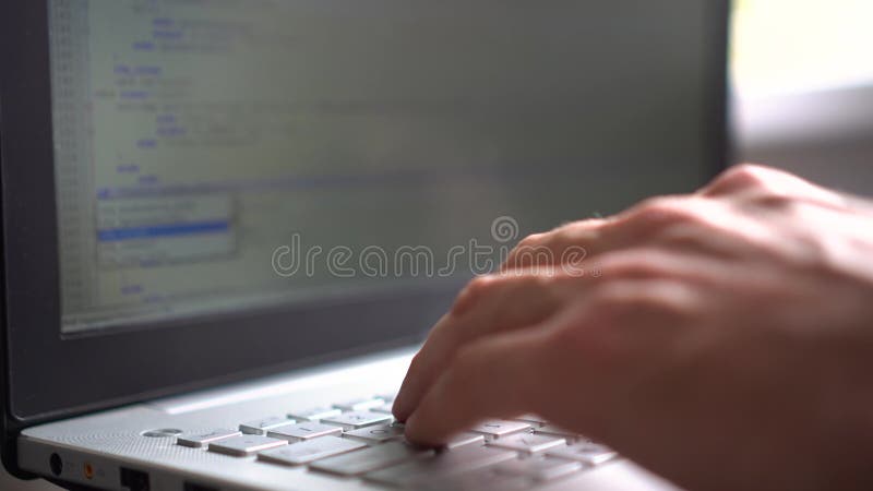 Website or software development - programmer working on laptop stock video footage