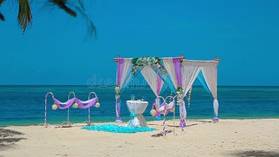 https://thumbs.dreamstime.com/b/wedding-arch-caribbean-beach-table-decorations-ready-wedding-ceremony-crimson-blue-wedding-arch-caribbean-183664670.jpg?w=400