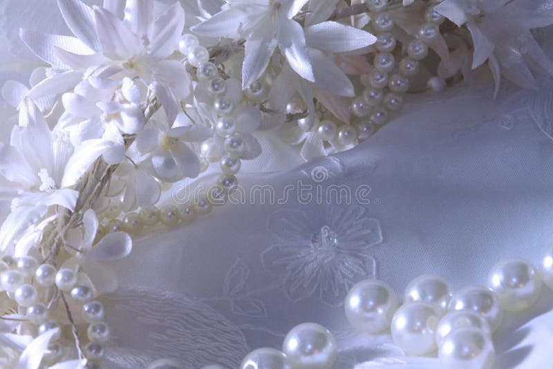 Wedding background with lace, pearls and ribbons.