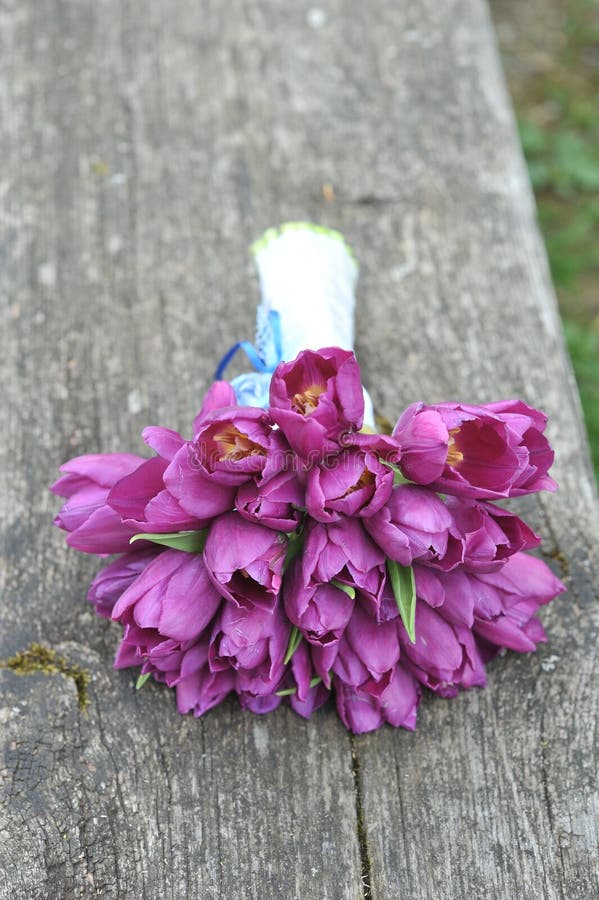 Wedding bouquet of bride - colorful flowers pink/violet tulips