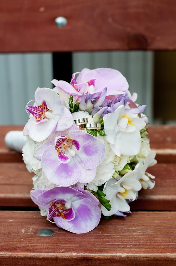 Wedding Bouquet on Brown Bench with Rings Stock Image Image of wooden