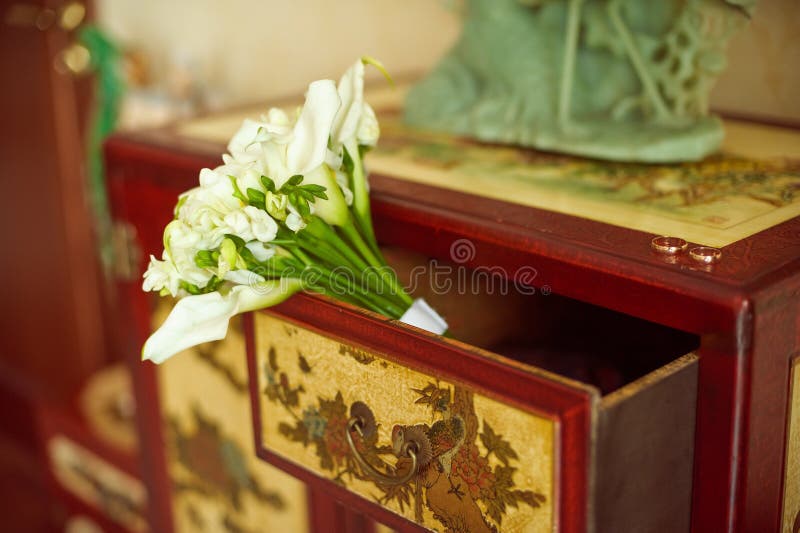 Wedding bouquet of lilies on the dresser. Wedding bouquet of lilies on the dresser