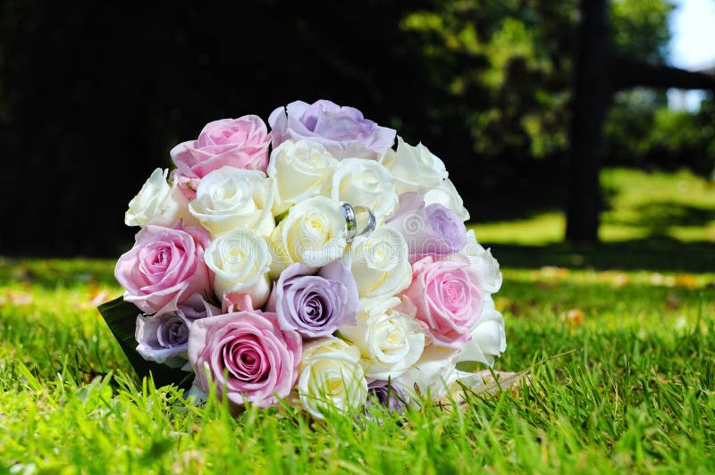 Wedding bouquet and golden rings