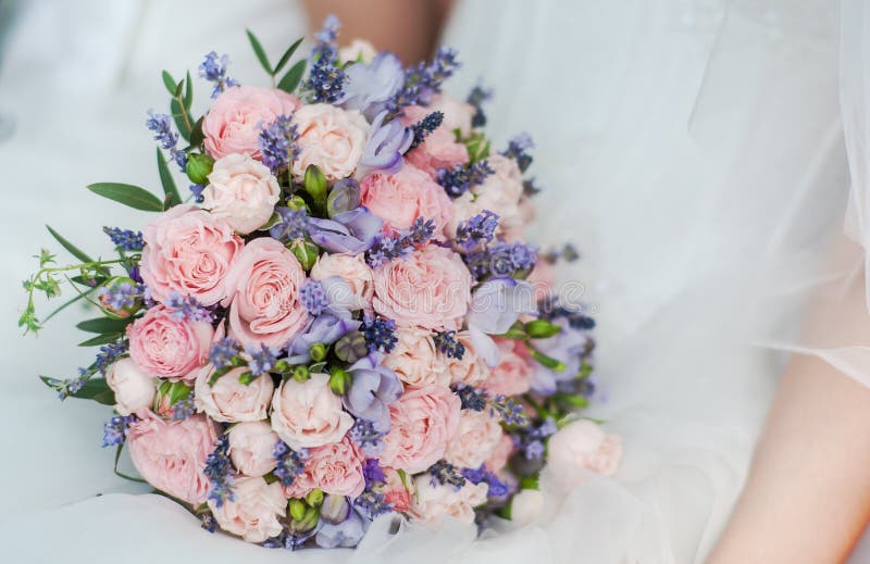 Wedding bouquet of lavender, roses and peonies.