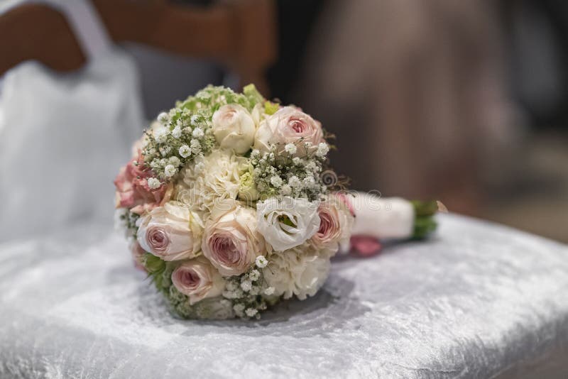 Wedding bouquet of roses and other flowers lying on a bench royalty free stock images Wedding bouquet of roses and other flowers lying on a bench royalty free stock images
