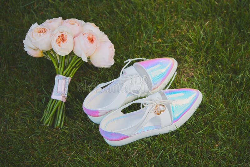 Wedding Bouquet and Shoes Lying Down on Green Grass Stock Photo Image