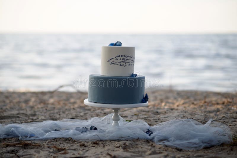 Wedding cake on the beach stock image. Image of customized 87624313