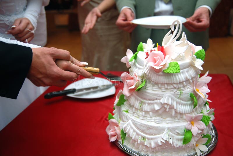 Wedding cake with broom and bride