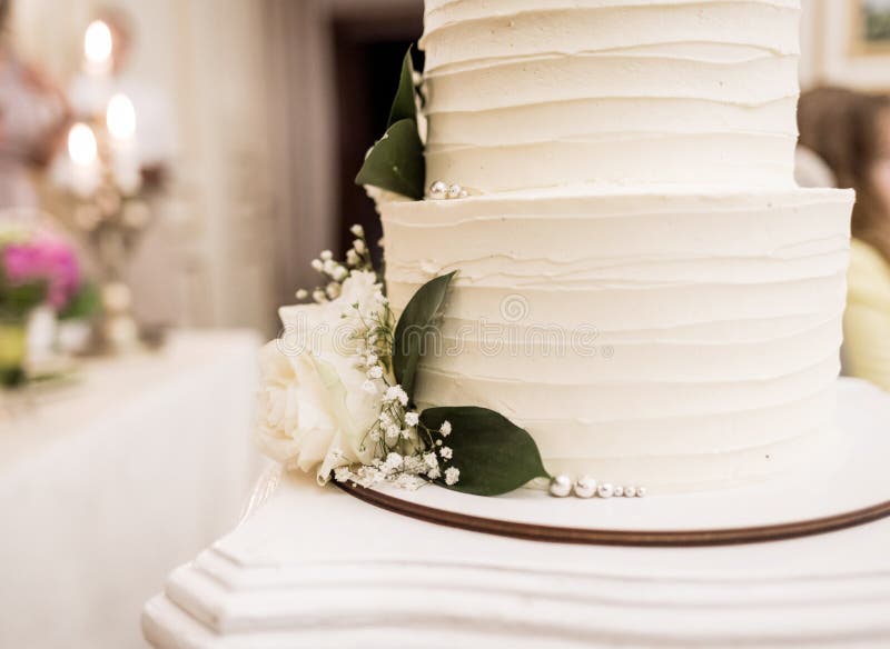 Wedding cake with flowers stock photo. Image of luxury 229111820