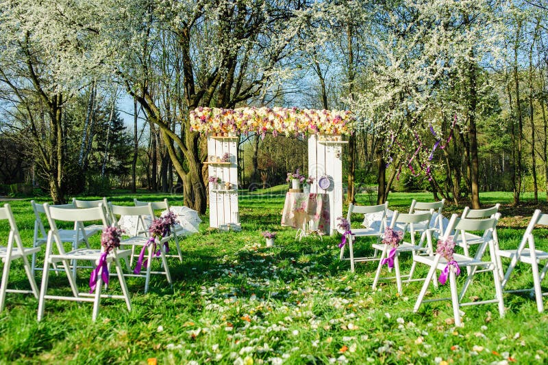 Wedding ceremony in blooming garden stock photos