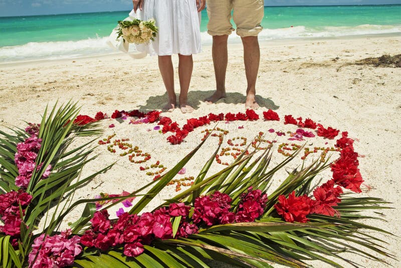 Wedding couple in Caribbean beach stock images