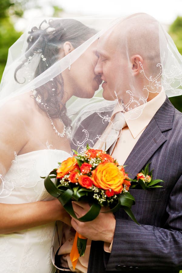 Wedding couple kissing royalty free stock photos