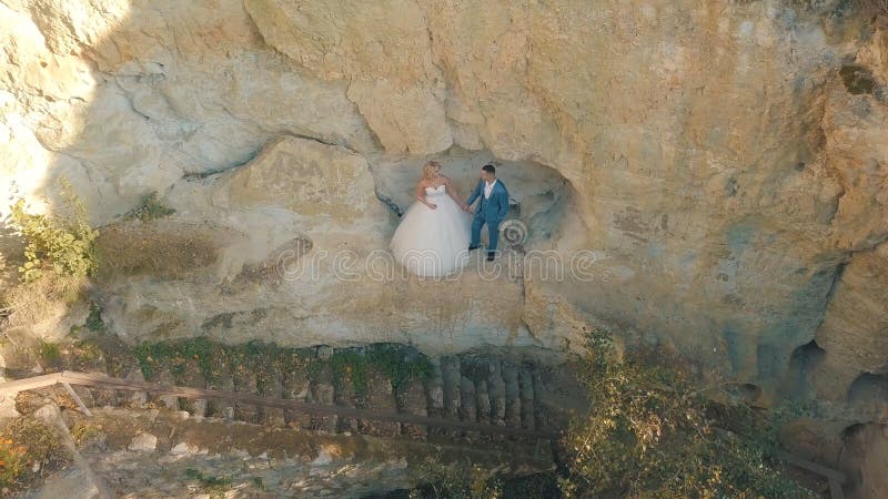 Wedding couple stand on a slope of the mountain hill. Lovely groom and bride royalty free stock photos Wedding couple stand on a slope of the mountain hill. Lovely groom and bride royalty free stock photos