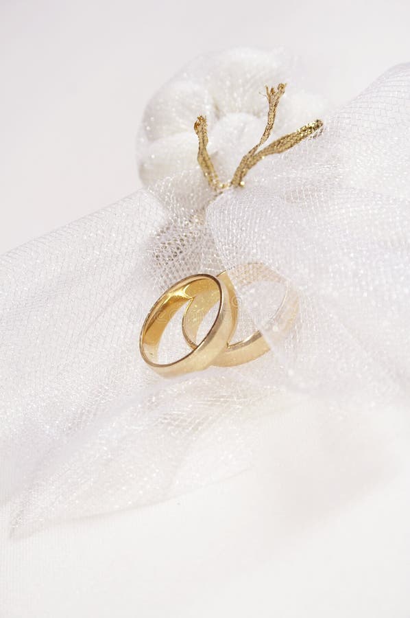 Wedding rings on veil and candies. Wedding rings on veil and candies
