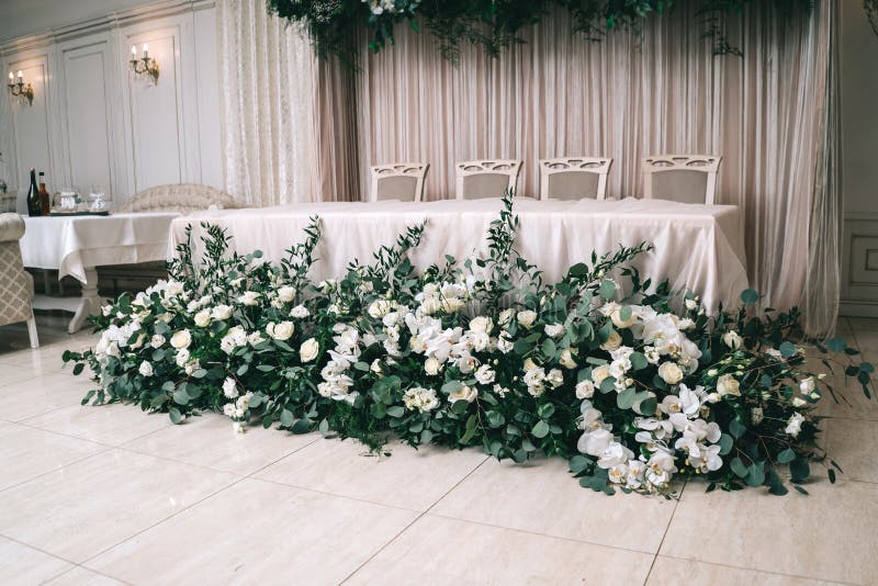 Wedding decor, accessories, orchids, roses, eucalyptus, a bouquet in a restaurant, chairs table setting royalty free stock images Wedding decor, accessories, orchids, roses, eucalyptus, a bouquet in a restaurant, chairs table setting royalty free stock images