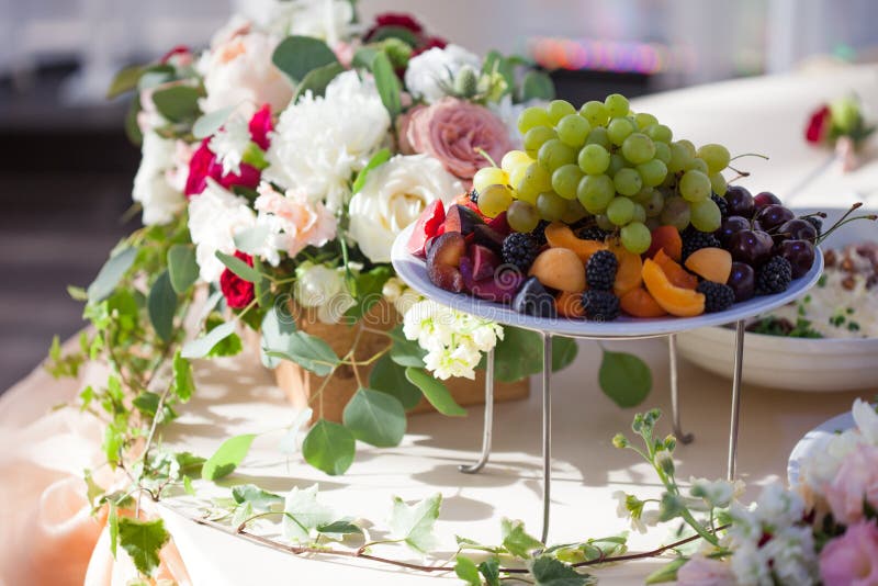 Wedding Decor. Flowers in the Restaurant, Food on the Table Stock Photo