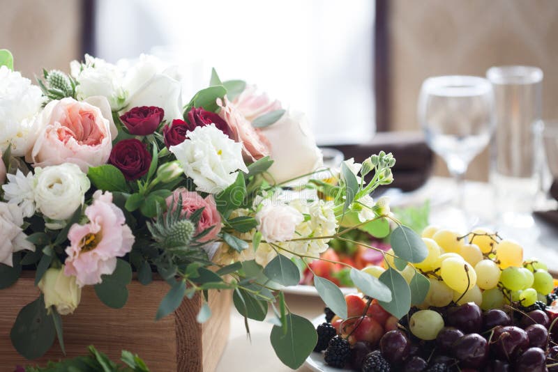 Wedding Decor. Flowers in the Restaurant, Food on the Table Stock Photo