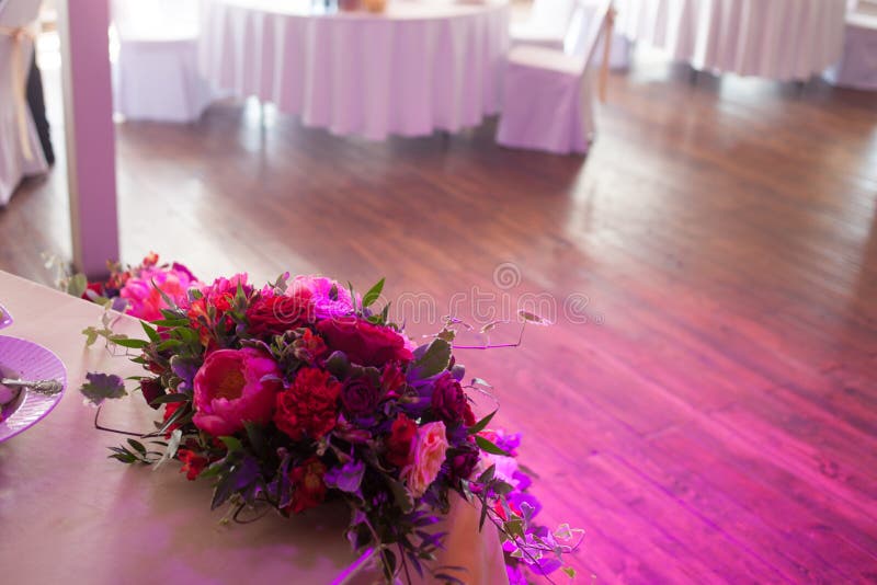 Wedding decor. Red Flowers in the restaurant, table setting stock images Wedding decor. Red Flowers in the restaurant, table setting stock images